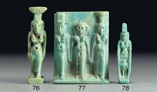 AN EGYPTIAN FAIENCE AMULET OF WINGED ISIS WITH HORUS THE FALCON