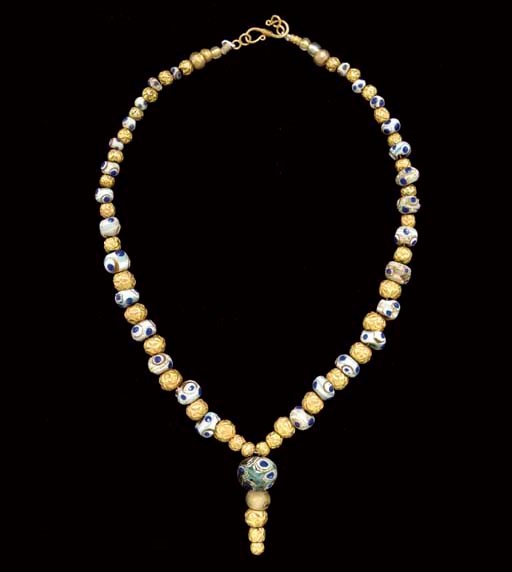 A PHOENICIAN GLASS EYE BEAD NECKLACE