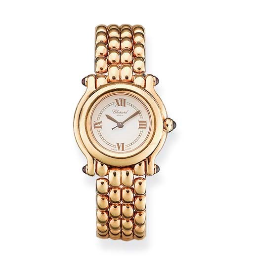 MONTRE BRACELET DE DAME "HAPPY SPORT" OR ET RUBIS, PAR CHOPARD