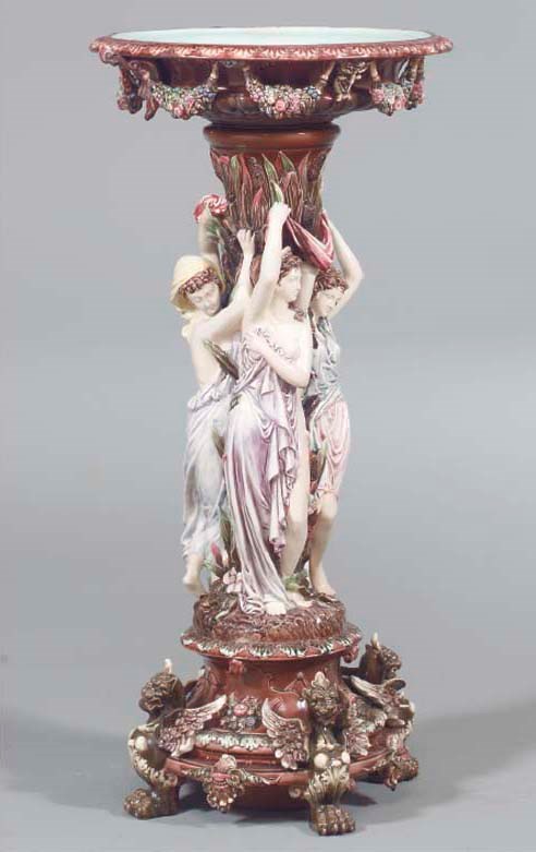 A CONTINENTAL MAJOLICA JARDINIERE ON STAND,