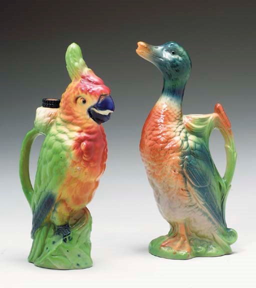 THREE POLYCHROME GLAZED FAIENCE BIRD-FORM EWERS,
