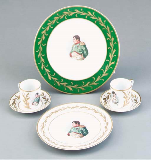 A LIMOGES TRANSFER-PRINTED DINNER PLATE AND A PAIR OF LIMOGES CUPS AND SAUCERS,