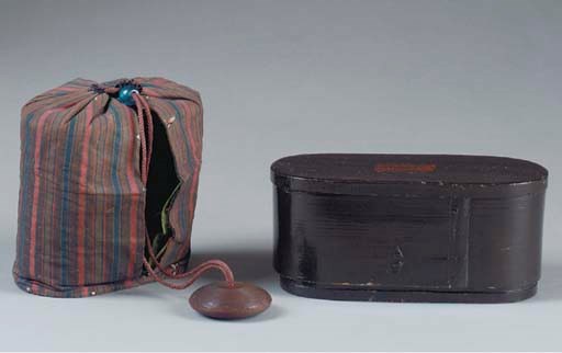 AN INRO-TYPE BLACK LACQUED COVERED BOX TOGETHER WITH AN OVAL COVERED BLACK LAQUER BOX,