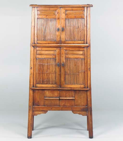 AN ASIAN WOOD CABINET,