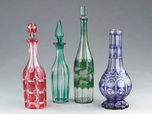 THREE BOHEMIAN COLORED CUT-GLASS DECANTERS AND STOPPERS,