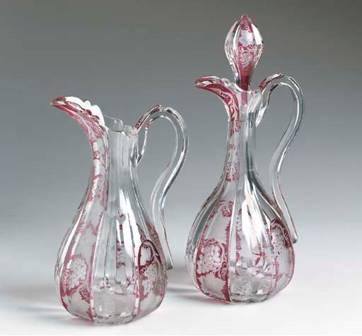 AN ENGLISH AMETHYST-FLASH C;ARET AND WATER JUG SET,