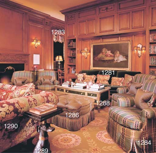 A SOFA UPHOLSTERED IN GREEN VELVET,