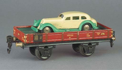 A  Märklin two-axle 1764A Low Open Wagon with diecast 5521/7 Pullman Limousine