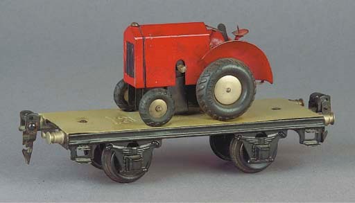 A  Märklin two-axle 1707 Special Load Wagon with  clockwork Field Tractor