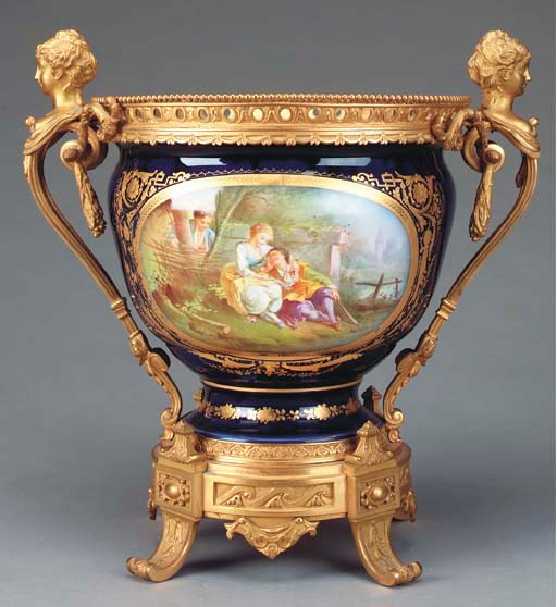 A SEVRES STYLE COBALT GROUND PORCELAIN AND GILT BRONZE MOUNTED CENTER BOWL,