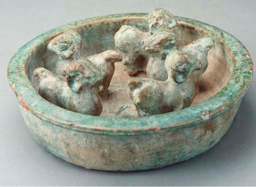 A CHINESE GREEN-GLAZED RED POTTERY MODEL OF AN ANIMAL PEN,