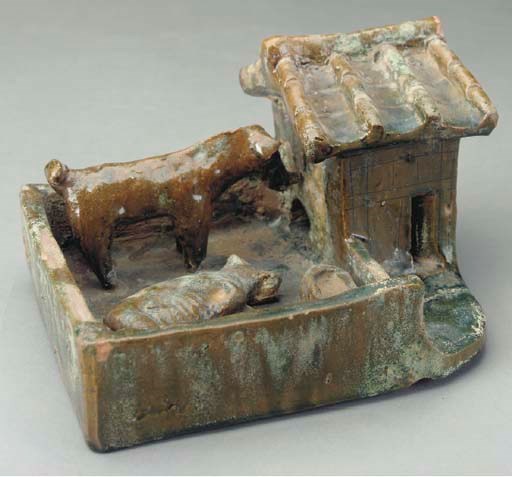 A CHINESE GREEN-GLAZED RED POTTERY MODEL OF A STABLE,