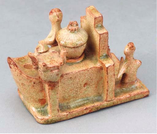 A CHINESE STRAW-GLAZED POTTERY MODEL OF A STOVE,