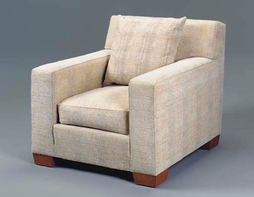 A CONTEMPORARY CLUB CHAIR UPHOLSTERED IN TEXTURED PLUSH AFTER A DESIGN BY JEAN-MICHEL FRANK,