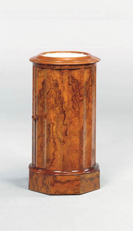 A CONTINENTAL WALNUT MARBLE-INSET PEDESTAL CABINET,
