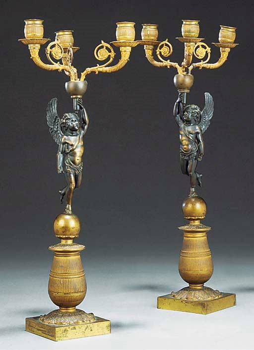 A PAIR OF EMPIRE GILT AND PATINATED BRONZE THREE-LIGHT CANDELABRA