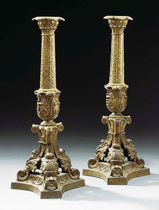 A PAIR OF LOUIS PHILIPPE BRONZE PATINATED SPELTER CANDLESTICKS
