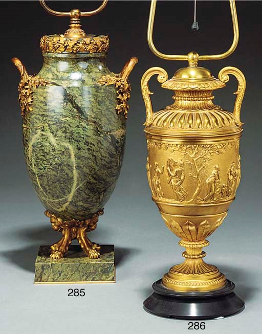 A GILT BRONZE AND VARIEGATED MARBLE TABLE LAMP