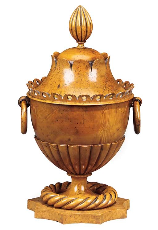 A Napoleon III ornamentally turned burr maple standing cup and cover