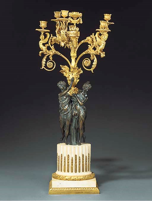 A French gilt and patinated bronze six light candelabrum