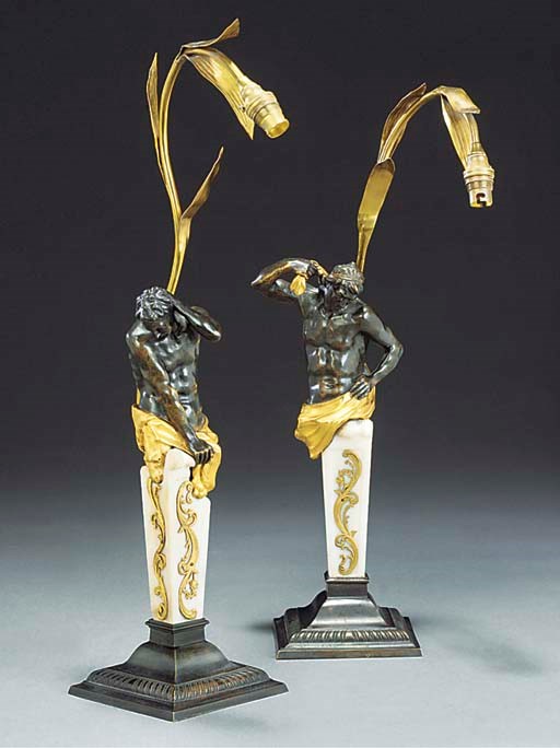A PAIR OF GILT AND PATINATED BRONZE TABLE LAMPS