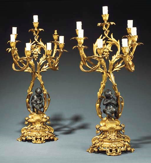 A PAIR OF NAPOLEON III GILT AND PATINATED BRONZE SEVEN-LIGHT CANDELABRA