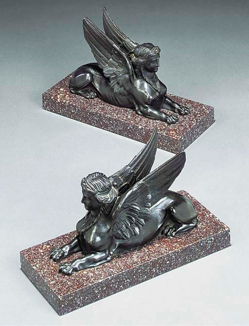 A pair of Continental iron sphinxes
