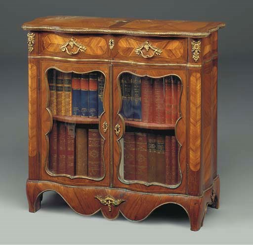 A FRENCH ORMOLU MOUNTED KINGWOOD AND TULIPWOOD SERPENTINE SIDE CABINET
