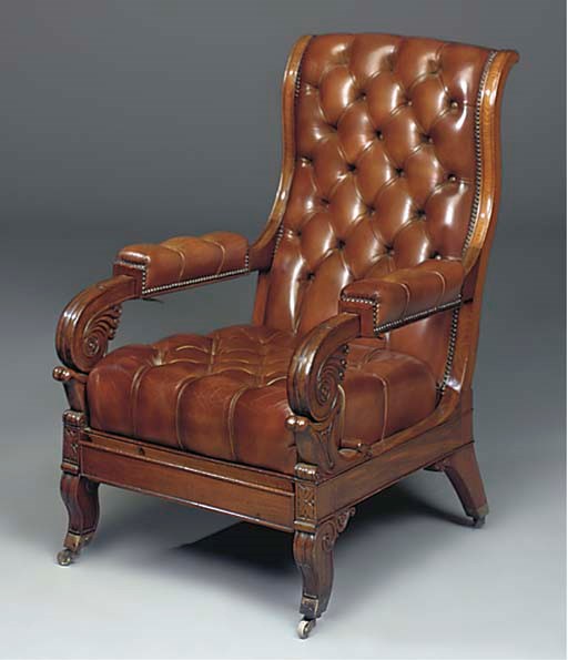A LOUIS PHILIPPE MAHOGANY AND BROWN LEATHER UPHOLSTERED RECLINING ARMCHAIR
