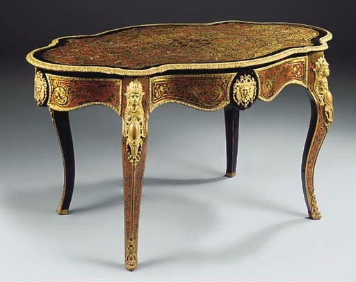 A NAPOLEON III ORMOLU MOUNTED EBONISED SCARLET TORTOISESHELL AND BRASS INLAID SERPENTINE CENTRE TABLE
