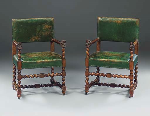 A SET OF FOUR FLEMISH WALNUT AND GREEN LEATHER UPHOLSTERED ARMCHAIRS