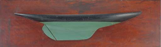 A large painted half model of a sailing yacht