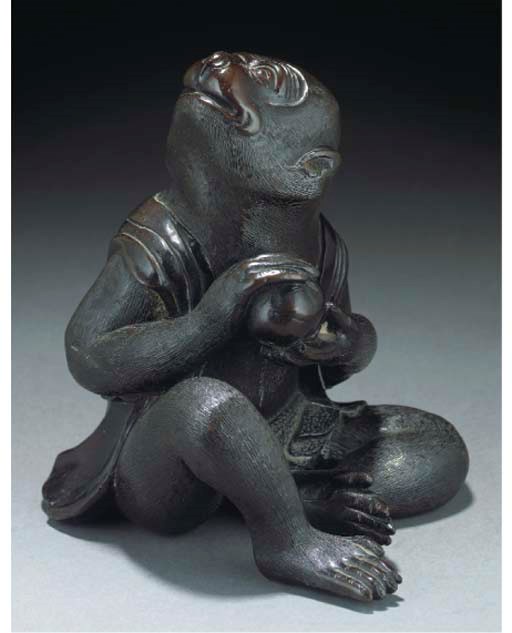 A Japanese bronze model of a seated monkey, 19th Century