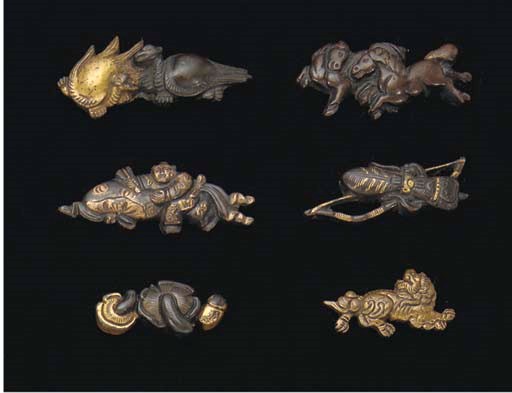 Eleven various Japanese bronze menuki, 19th Century