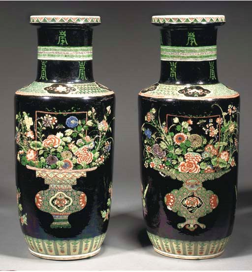 A pair of Chinese famille verte noire ground rouleau vases, 19th Century