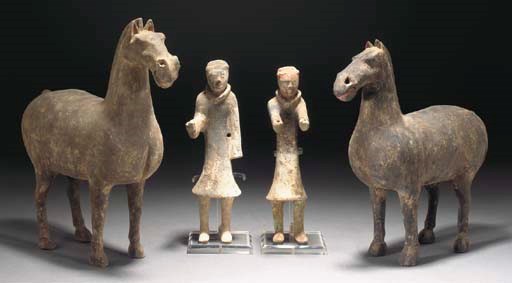 Two Chinese pottery models of horses and grooms, Han Dynasty
