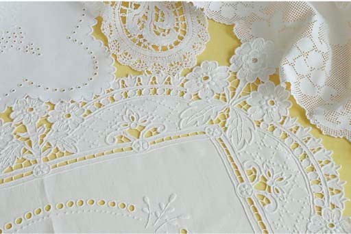 (17) A collection of openworked and embroidered linen table covers