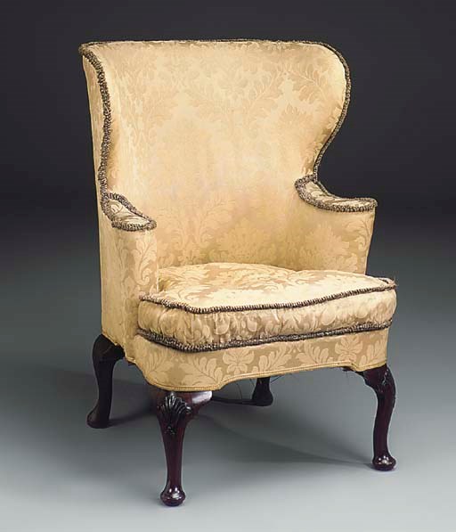 A MAHOGANY WING ARMCHAIR