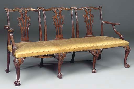 A MAHOGANY TRIPLE CHAIR BACK SOFA