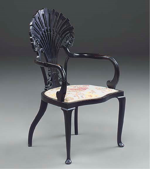 An ebonised armchair