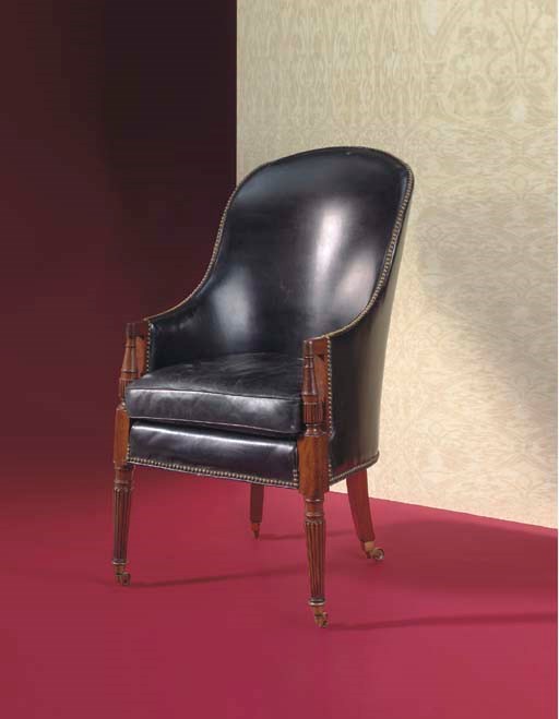 A REGENCY MAHOGANY LIBRARY ARMCHAIR