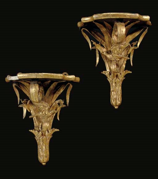 A PAIR OF VICTORIAN GILTWOOD, GILT COMPOSITION AND EBONIZED BRACKETS