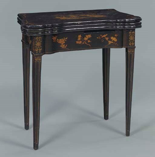 A CHINESE EXPORT BLACK AND GOLD LACQUER AND JAPANNED GAMES TABLE