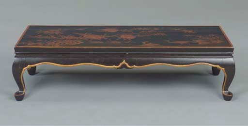 A CHINESE BLACK AND GOLD LACQUER LOW TABLE