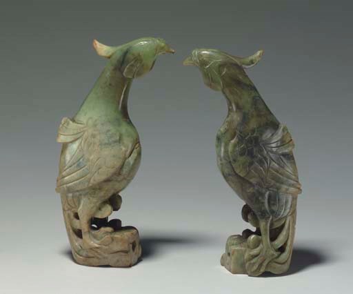 A PAIR OF MOTTLED GREY AND GREEN JADE PHOENIXES