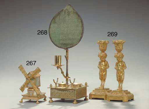 A PAIR OF LOUIS XVI STYLE ORMOLU CANDLESTICKS