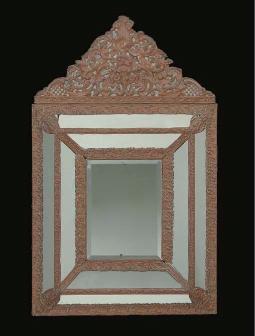 A FLEMISH REPOUSSE COPPER MIRROR