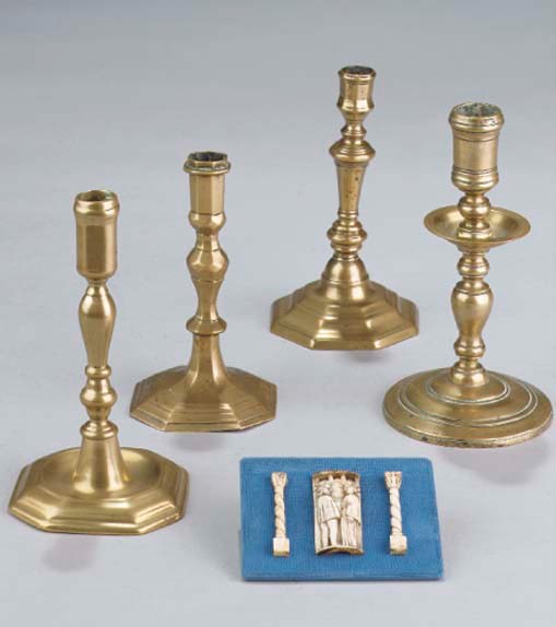 Four various brass candlesticks
