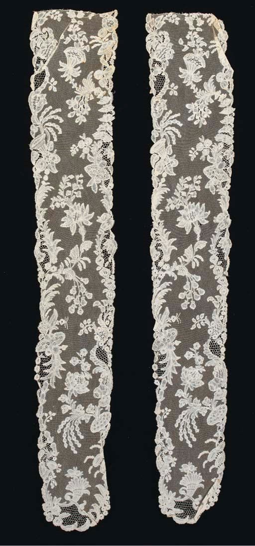 A pair of Brussels bobbin lace lappets worked at each end with a cornucopia, with hand-made net ground--66cm long, 11cm at widest point, 1740s