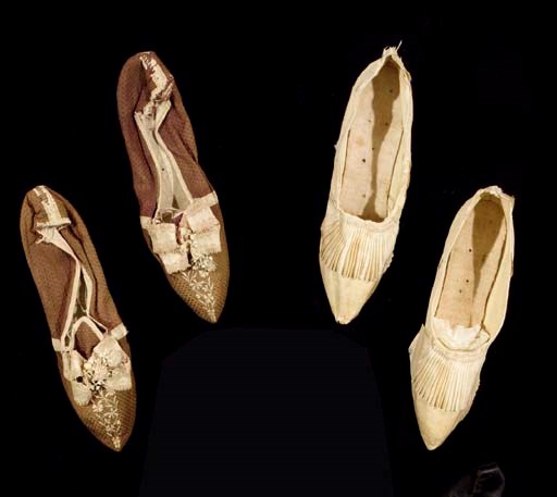 A pair of lady's ivory figured silk shoes, trimmed with a grosgrain pleated ribbon frill, the silk covered heels 5cm high; and another pair of lady's shoes of snuff coloured figured silk, trimmed with faded pink silk fly braid and ribbon, the heels in contrasting silk, 6in high, inscribed inside Mrs Strickland, 1770s in either shoe 	 (2)